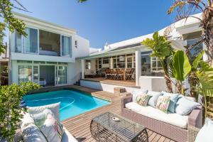 an image of a house with a swimming pool at White Waves Beach House in Bloubergstrand