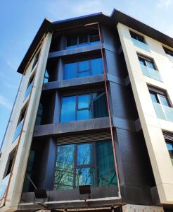 an apartment building with a black facade at Triada Hotel Karaköy in Istanbul