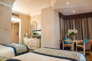 Ένα ή περισσότερα κρεβάτια σε δωμάτιο στο Novel Hotel City Center +37 φωτογραφίες