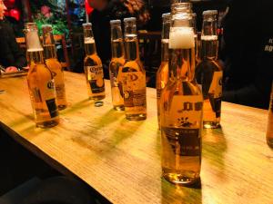 a group of bottles of beer sitting on a table at Wang Jiang Reclusive Boutique Inn in Fenghuang County