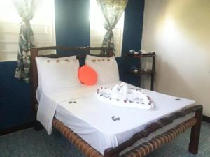Llit o llits en una habitació de Carpe Diem Nungwi
