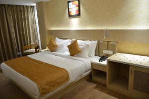 Krevet ili kreveti u jedinici u okviru objekta Hotel Radiance
