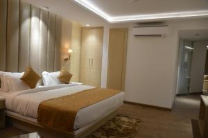 Krevet ili kreveti u jedinici u okviru objekta Hotel Radiance