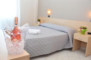 Postel nebo postele na pokoji v ubytování Hotel Excelsior