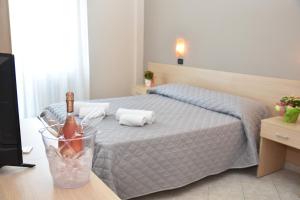 Postel nebo postele na pokoji v ubytování Hotel Excelsior