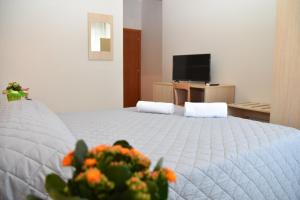 Postel nebo postele na pokoji v ubytování Hotel Excelsior