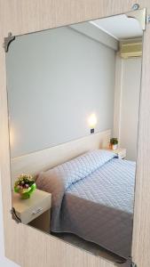 Postel nebo postele na pokoji v ubytování Hotel Excelsior