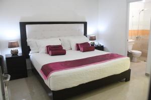 Postel nebo postele na pokoji v ubytování Hostal San Francisco de Asis