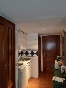 a kitchen with a sink and a counter top at Pequeño y Coqueto Piso en Riaza in Riaza