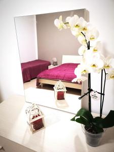 Posteľ alebo postele v izbe v ubytovaní FIORI E COLORI