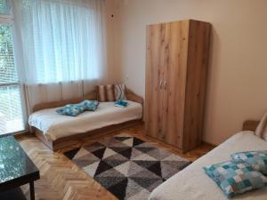 מיטה או מיטות בחדר ב-Guest House Krasi
