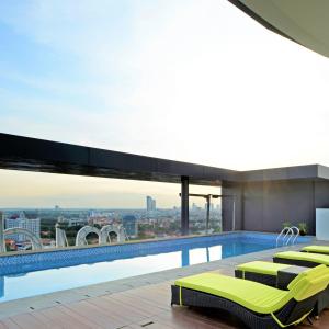 a swimming pool on the roof of a building at Midtown Residence Surabaya in Surabaya