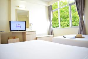 Postel nebo postele na pokoji v ubytování Trang Hotel Bangkok - SHA Plus