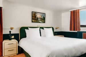 Voodi või voodid majutusasutuse Experimental Chalet toas