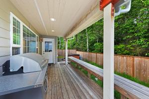 a porch of a home with a wooden deck at Gleneden Beach Escape in Gleneden Beach