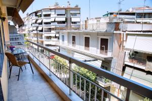 a balcony with a view of a building at Comfortable House with Warm Hospitality in Katerini