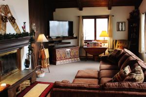 a living room with a couch and a television at 4 Bed 2 Bath Vacation home in Franconia in Franconia
