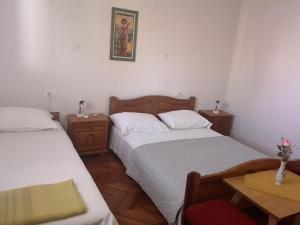 Postel nebo postele na pokoji v ubytování Apartmani Sea