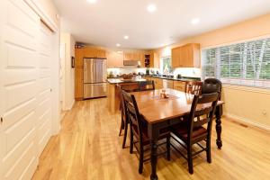 a kitchen with a wooden table and chairs at Gleneden Beach Escape in Gleneden Beach