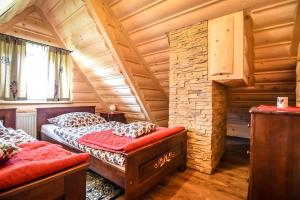 Posteľ alebo postele v izbe v ubytovaní "Chaupa na Walkoszach"Zakopane