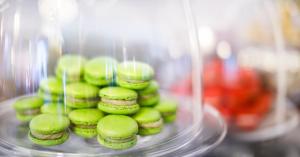 a stack of green cookies on a glass plate at Hotel Bellevue - Liburnia in Opatija