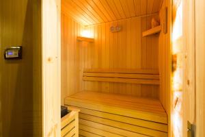 a wooden sauna with a wooden floor and a wooden door at Boutique Hotel Museum Belgrade in Belgrade +84 photos