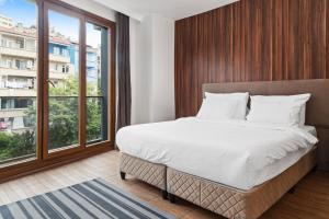 Postel nebo postele na pokoji v ubytování Modern Suites