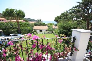 a view from the balcony of a house with flowers at Albatros in Capoliveri