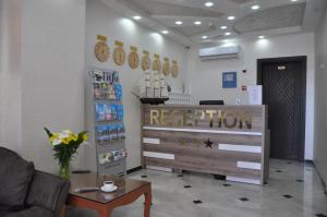 a waiting room with a recovery room with a table at Dream Tower in Batumi