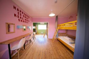Postel nebo postele na pokoji v ubytování Greenwood Hostel