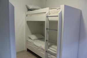 a bunk bed in a small room at Park Hostel Osh in Osh