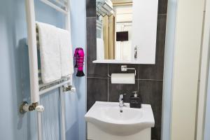 a bathroom with a white sink and a mirror at No 8 Galata in Istanbul +41 photos