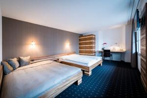 Ένα ή περισσότερα κρεβάτια σε δωμάτιο στο Gasthof zur Sonne