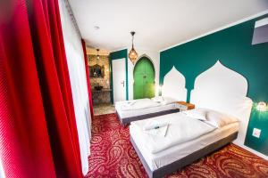 Postel nebo postele na pokoji v ubytování Hotel 4