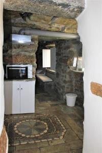 a kitchen with a counter and a microwave in a room at Gaia Vacation Home in Agia Mavra +66 photos
