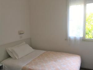 Postel nebo postele na pokoji v ubytování Hotel Floreale