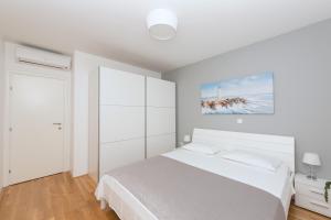 Posteľ alebo postele v izbe v ubytovaní Apartman IVONA