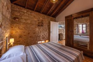 A bed or beds in a room at Rosalia Apartments