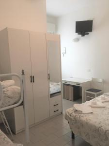 Postel nebo postele na pokoji v ubytování Hotel Floreale