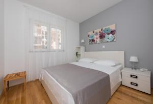 Posteľ alebo postele v izbe v ubytovaní Apartman IVONA