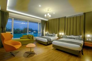 Postel nebo postele na pokoji v ubytování Four Vedas Hotel & Resort + 19 fotografií