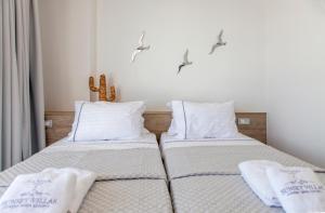 Posteľ alebo postele v izbe v ubytovaní SIVOTA SUNSET VILLAS + 25 fotografií