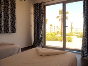 Una cama o camas en una habitación de Dakhla Camp 37 fotos más