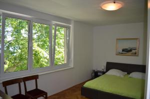 Posteľ alebo postele v izbe v ubytovaní Apartment Roxy