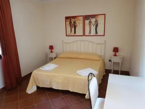 Posteľ alebo postele v izbe v ubytovaní Villaggio Turistico Airone