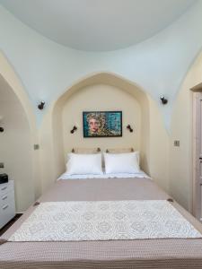 A bed or beds in a room at BIBLIOTHEQUE