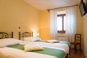 Postel nebo postele na pokoji v ubytování Guesthouse Muha