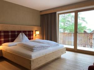 מיטה או מיטות בחדר ב-Hotel Schoenblick