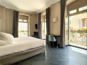 Rúm í herbergi á Hotel POZZO DI BORGO