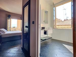 Rúm í herbergi á Hotel POZZO DI BORGO